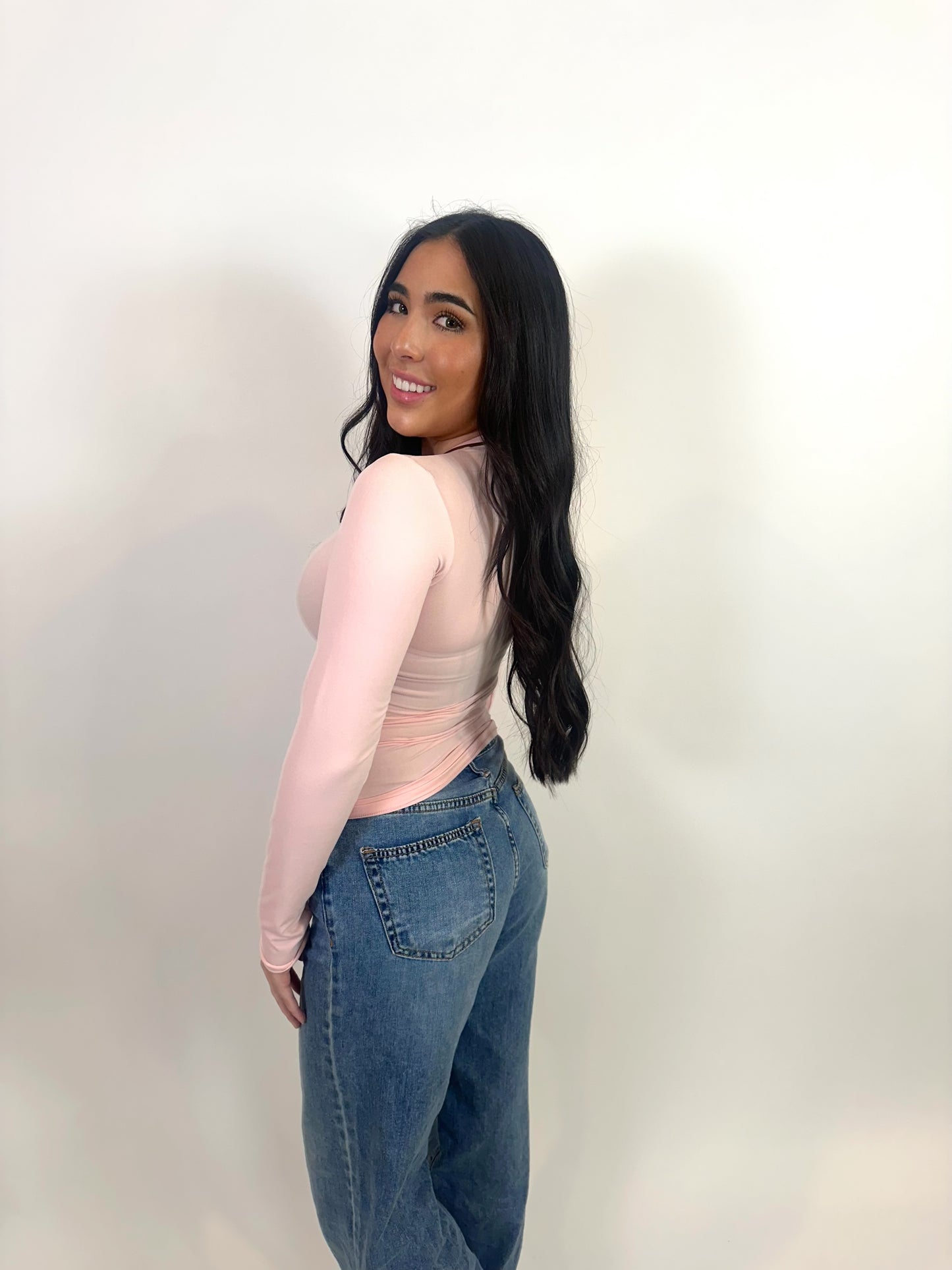 Side view of long sleeve light pink t-shirt